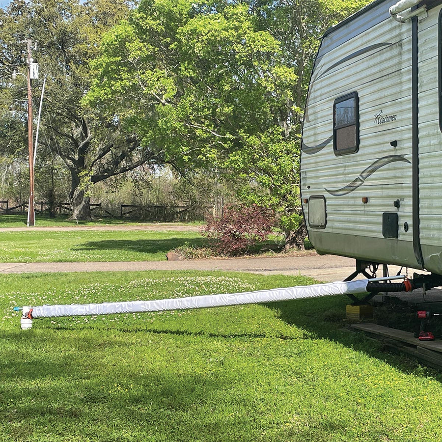 15 ft Levitator holding a covered RV sewer hose level from the camper to the drain