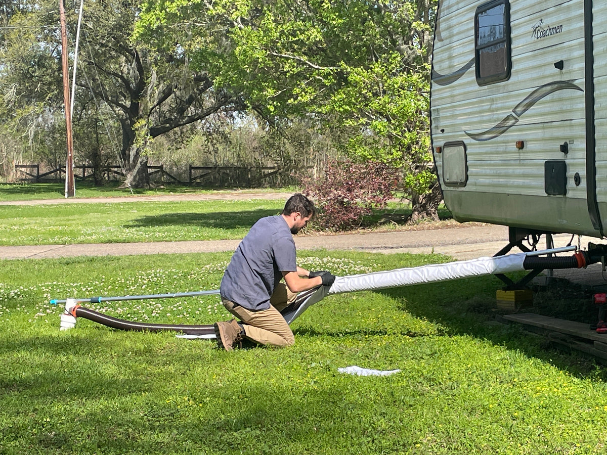 Sliding the sleeve over the sewer hose during setup